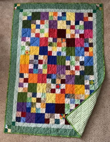 Multicolor squares with green backing, binding and border