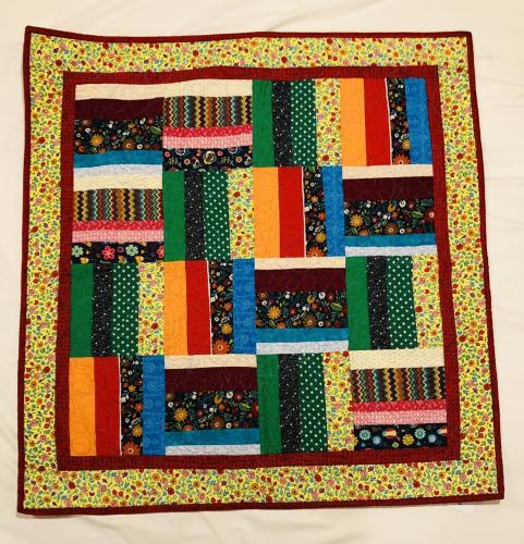 Baby quilt in bold colors